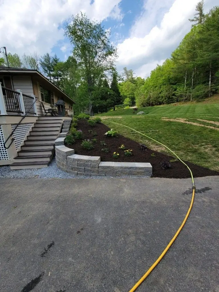 Driveway grading beside stone steps by Josh Field Landscaping