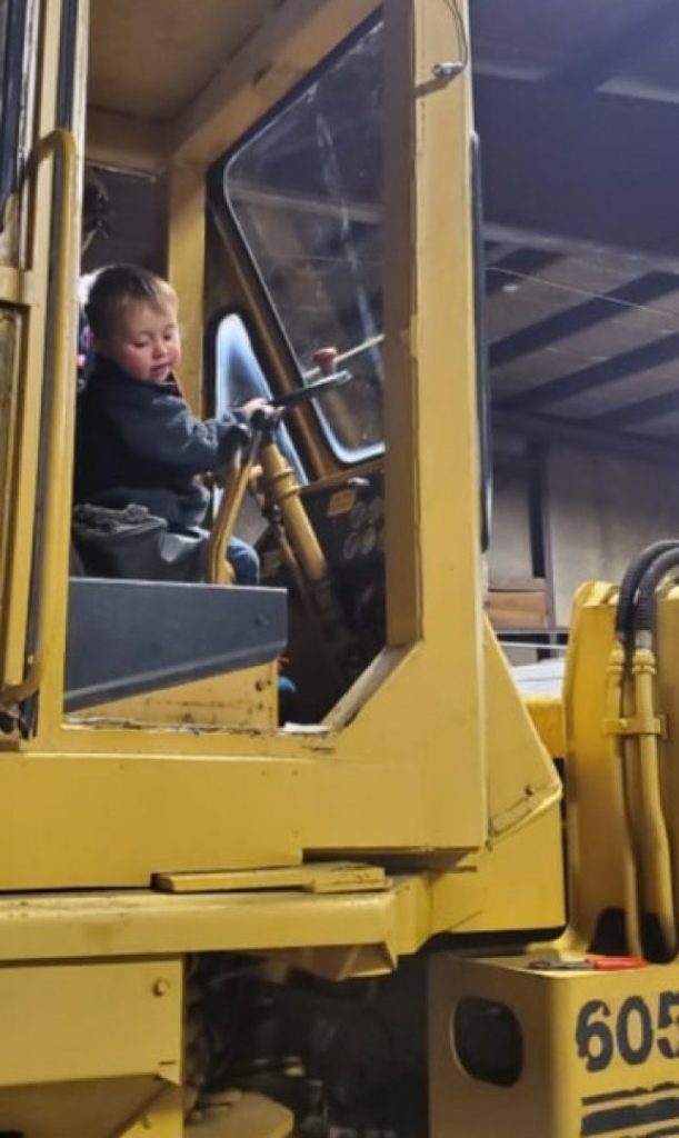 Operator in a loader cab by Josh Field Landscaping