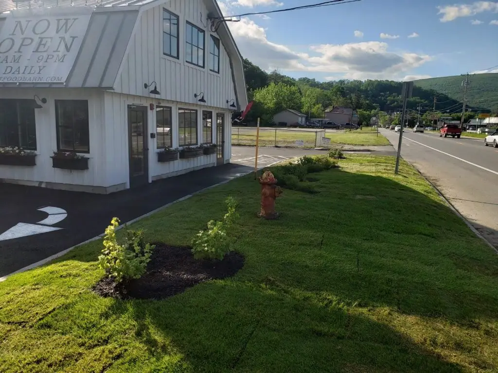 Lawn and plantings at a commercial building by Josh Field Landscaping
