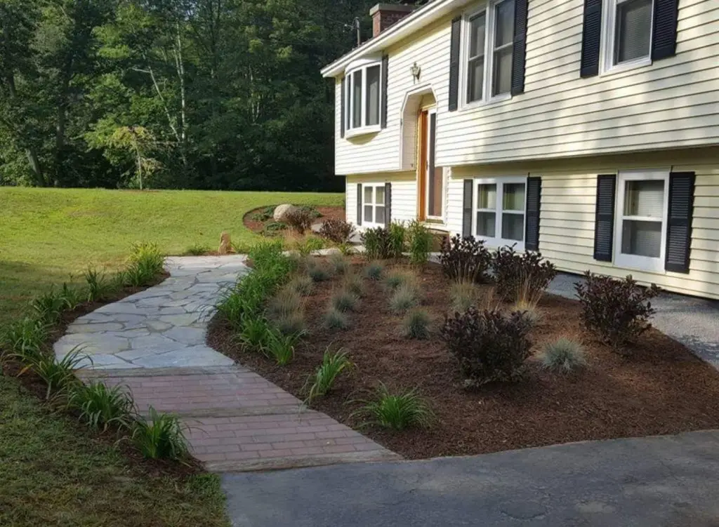 Curved front walk and new plantings by Josh Field Landscaping