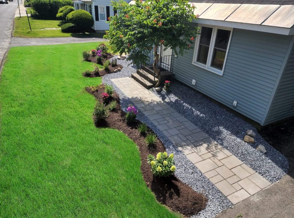 Side yard paver walk with a planted bed by Josh Field Landscaping