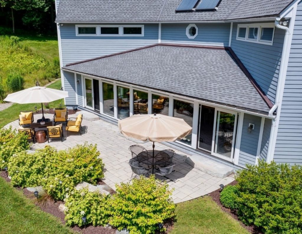 Aerial view of a backyard patio with seating by Josh Field Landscaping