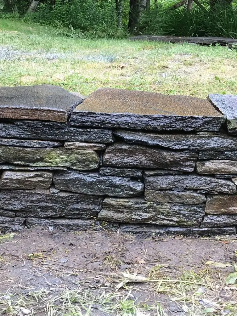 Dry stacked stone wall by Josh Field Landscaping
